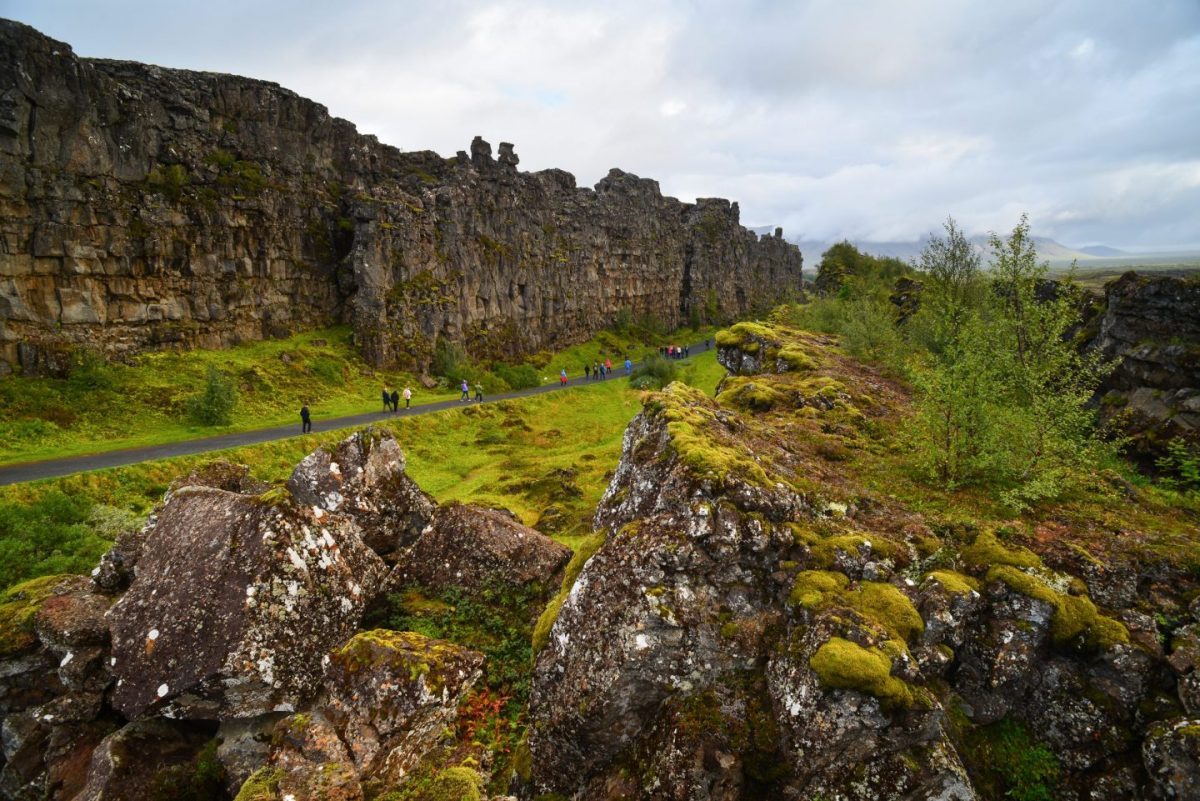 walking between european and american continents in thingvellir national park iceland
