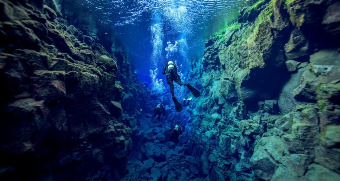 snorkelling between the continents in iceland